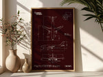 Airbus A300-600F Portrait Blueprint Poster by FlyKit displayed in a wooden frame on a white surface with plants nearby