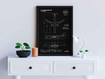 Airbus A330-900 Portrait Blueprint Poster by FlyKit framed on wall above white drawer with plants and lamp