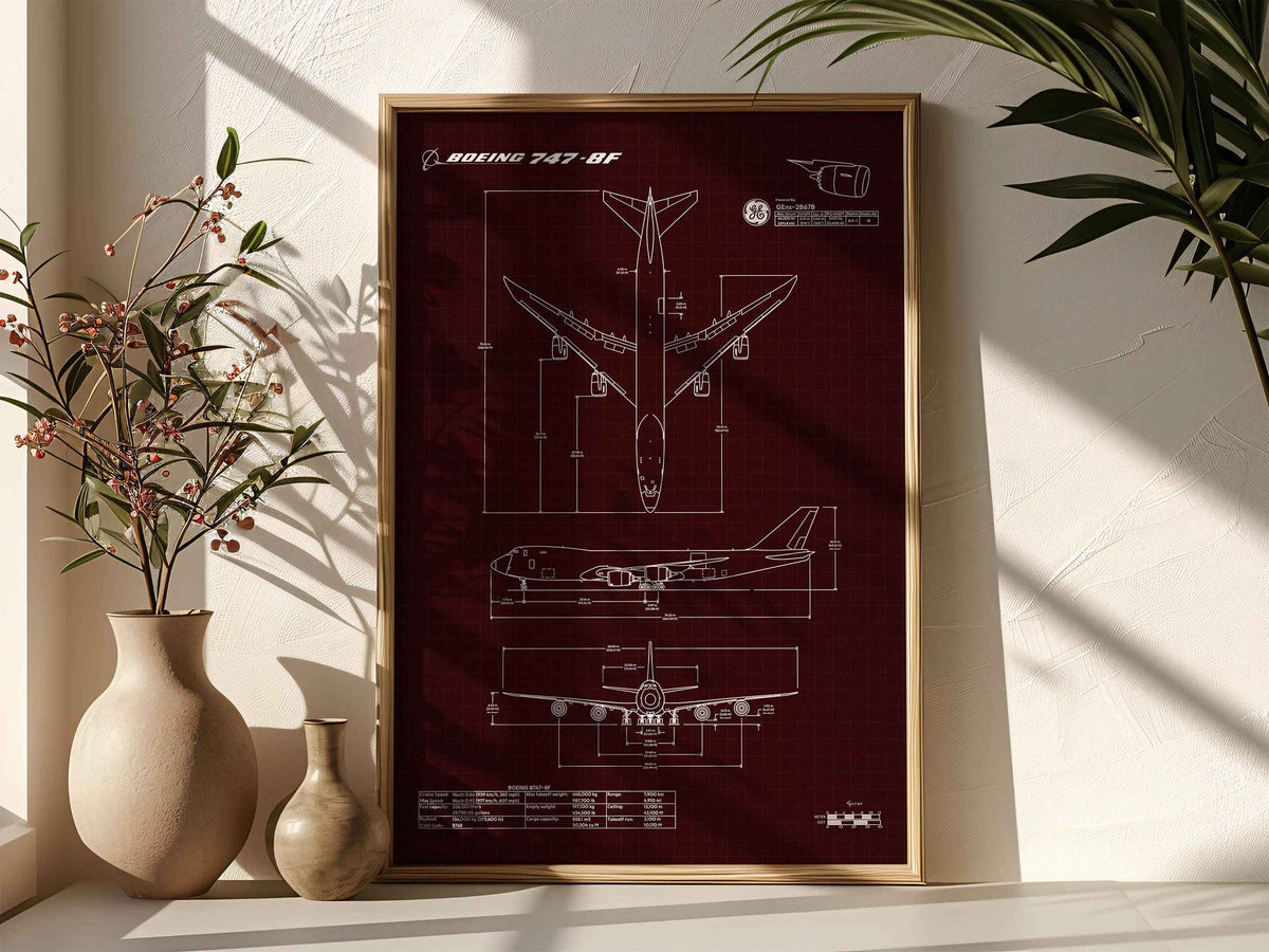 Boeing B747-8F Portrait Blueprint Poster by FlyKit framed and displayed on a wall with plants nearby