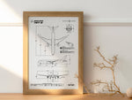 Boeing B787-8 Portrait Blueprint Poster by FlyKit displayed in wooden frame on table