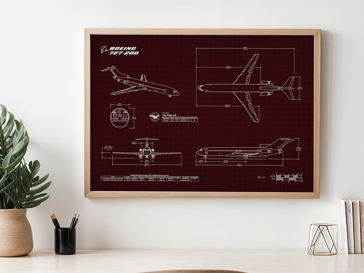Boeing B727-200 Landscape Blueprint Poster by FlyKit framed on wall above desk with plant and stationery