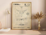 Boeing B777-200LR Portrait Blueprint Poster by FlyKit showing detailed aircraft design in a wooden frame on a shelf