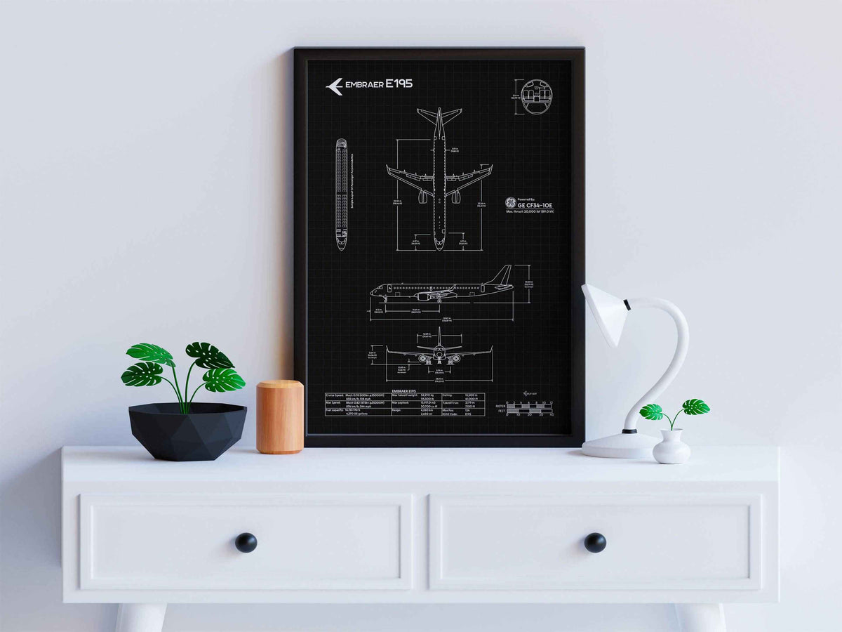 Embraer E195 Portrait Blueprint Poster by FlyKit displayed on a white desk with modern decor