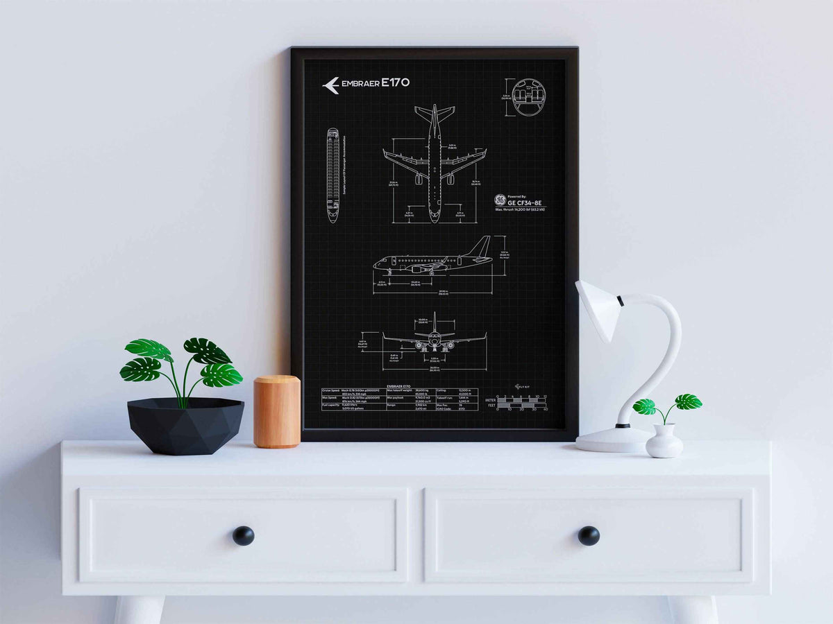 Framed Embraer E170 Portrait Blueprint Poster by FlyKit displayed on white drawer with modern decor